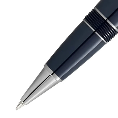A sleek navy blue montblanc rollerball pen with silver accents and textured grip from the world collection